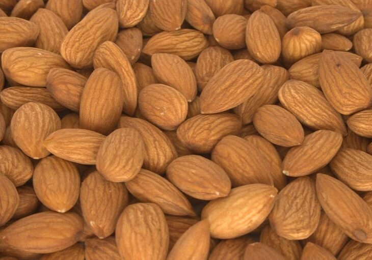 A close up of almonds in the shell